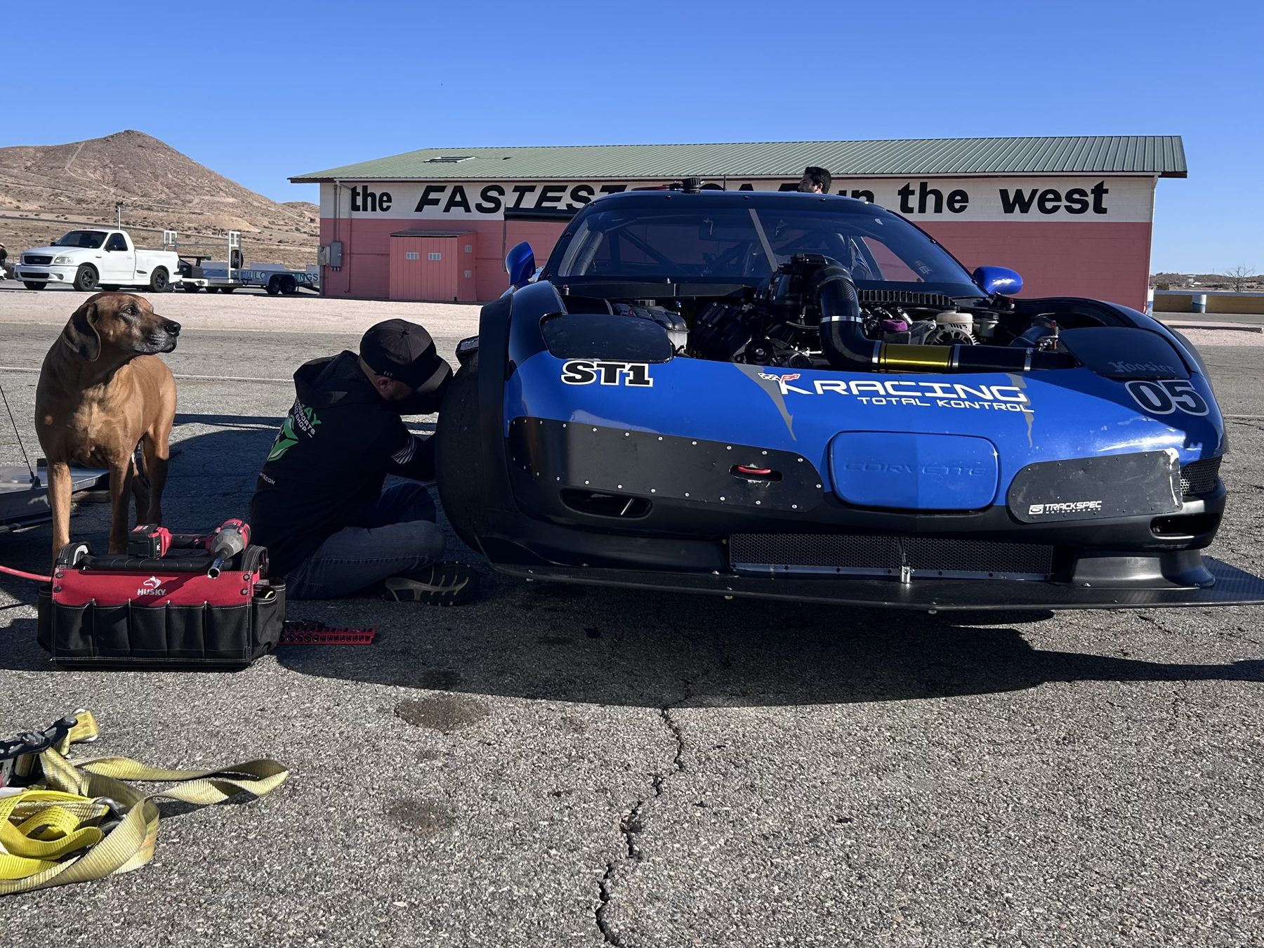 Front clip removed on the blue #05 C5 Corvette during trackside service