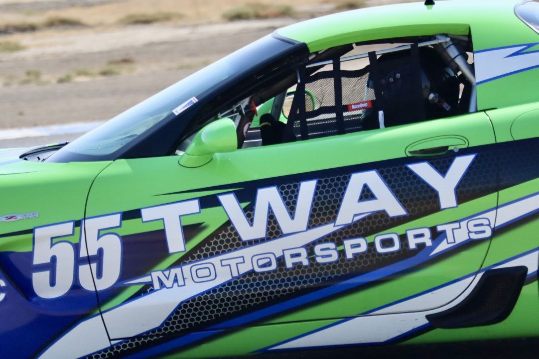Close-up of the #55 Tway Motorsports livery on the C5 door