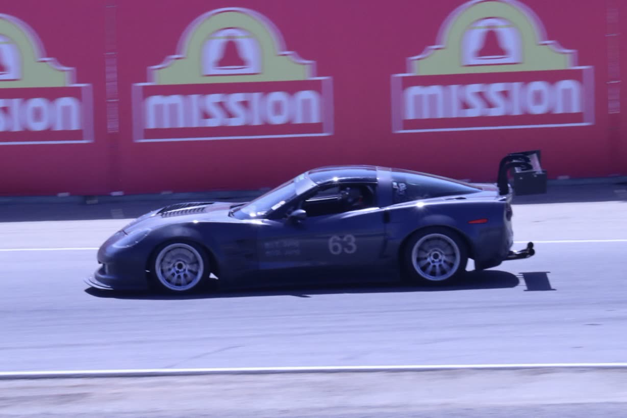 Gunmetal #63 C6 Corvette Z06 passing the Mission wall