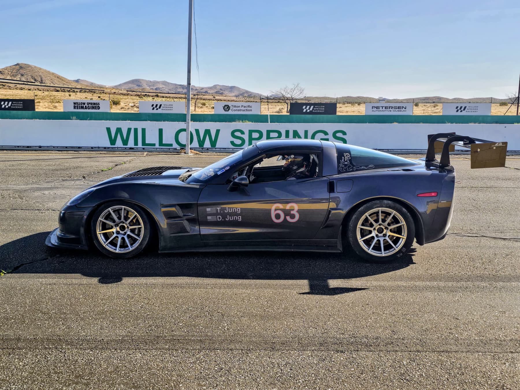Gunmetal #63 C6 Corvette Z06 side profile at Willow Springs
