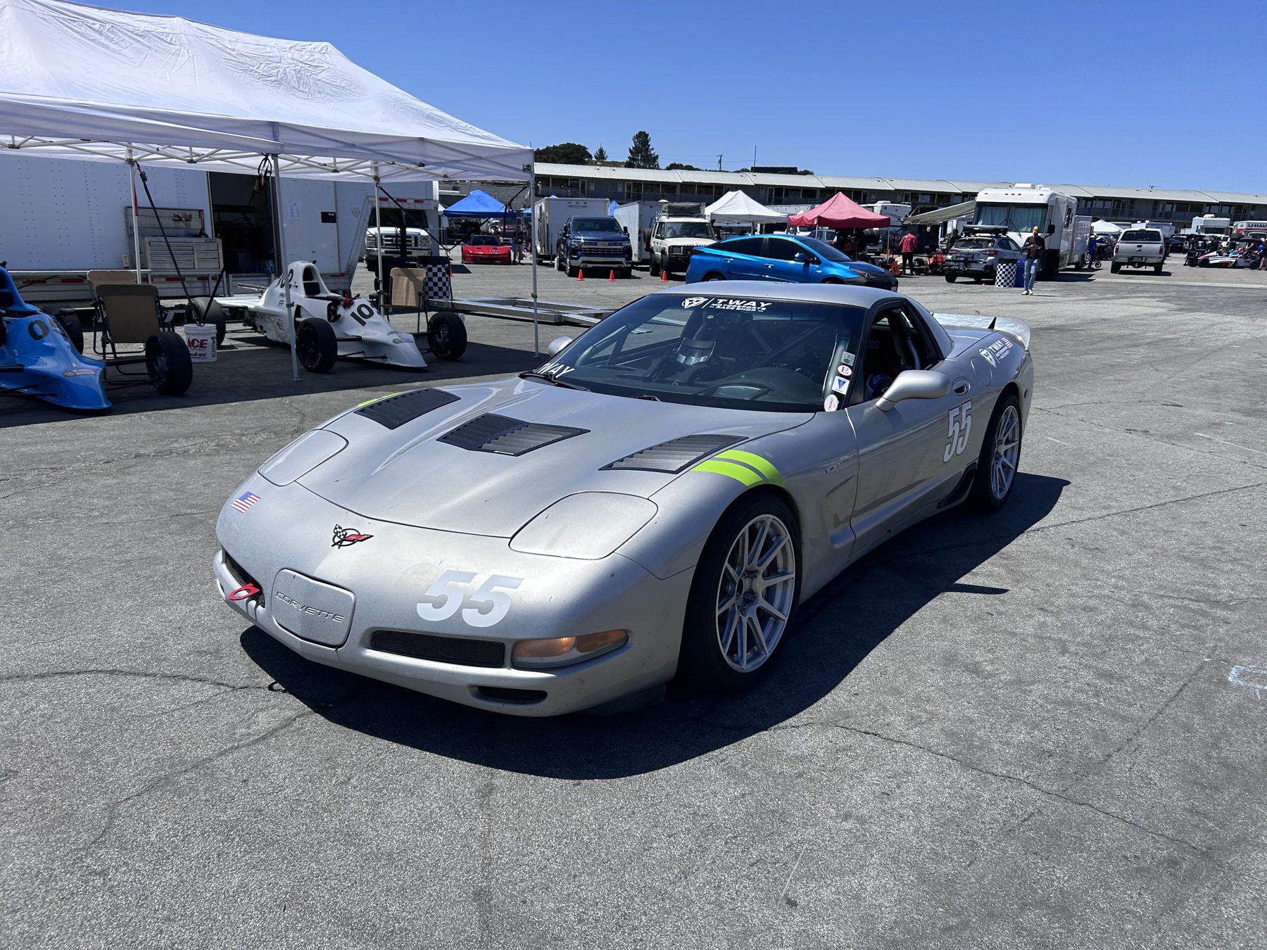 Silver #55 C5 Corvette Z06 in the paddock beside the Tway tent