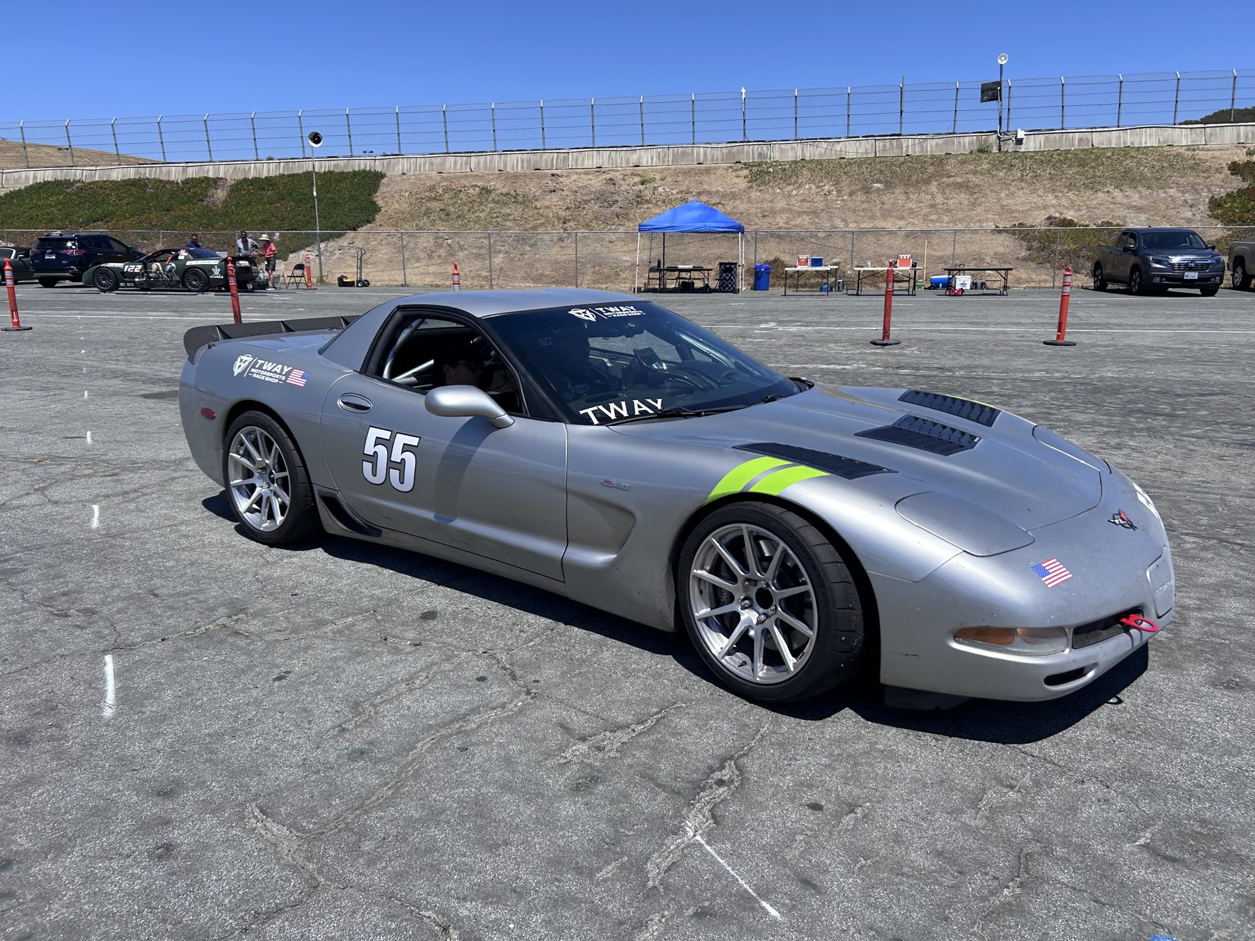 Silver #55 C5 Corvette Z06 at a race weekend